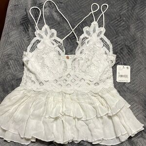 Brand New Free People sexy too in an off white color size small